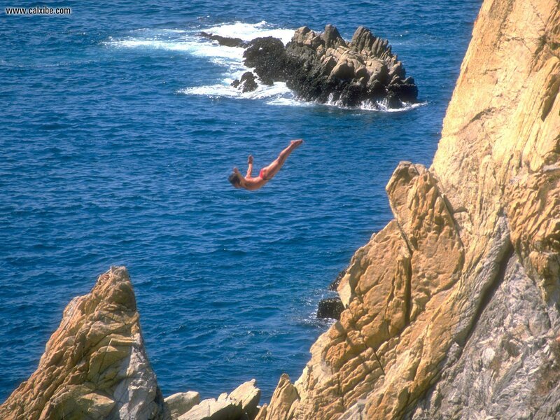 person diving from cliff