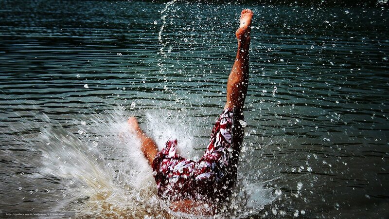 person diving into water