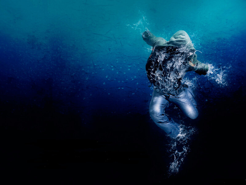 Person Diving Underwater — Blue, Dramatic