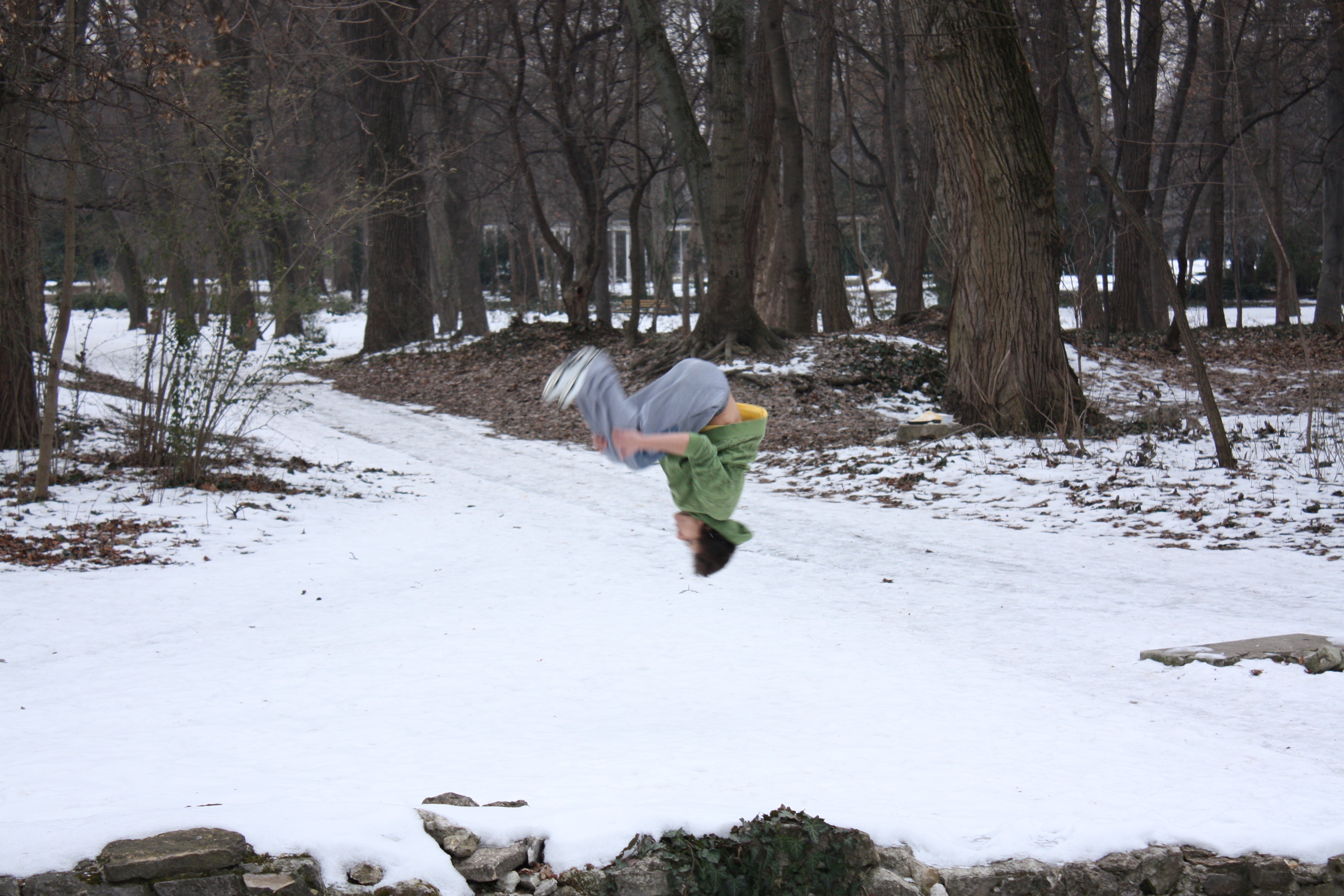 Person doing a backflip in snow