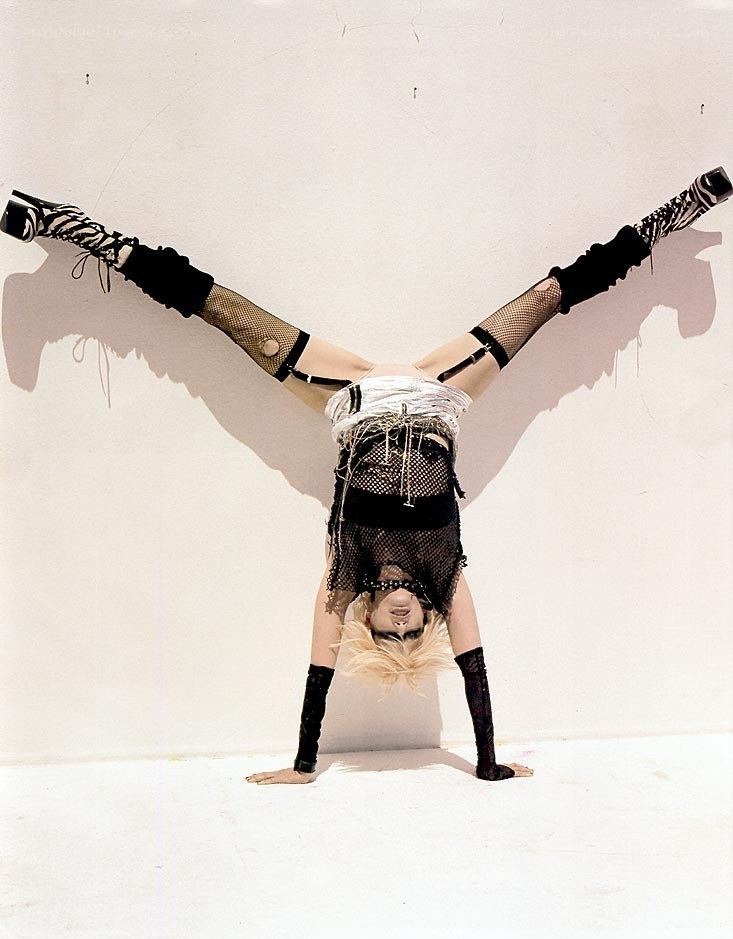 person doing a handstand in costume