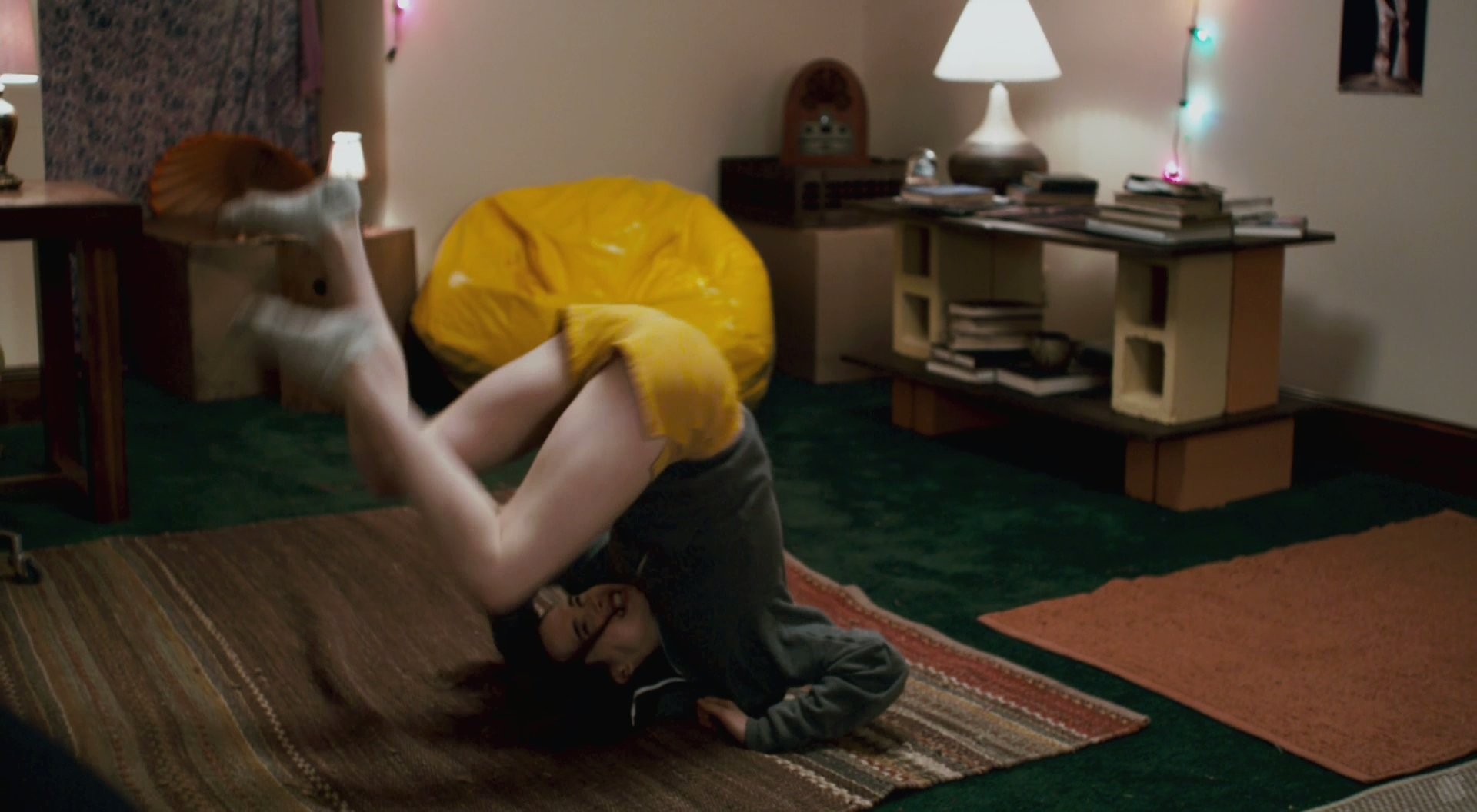 person doing a handstand on floor