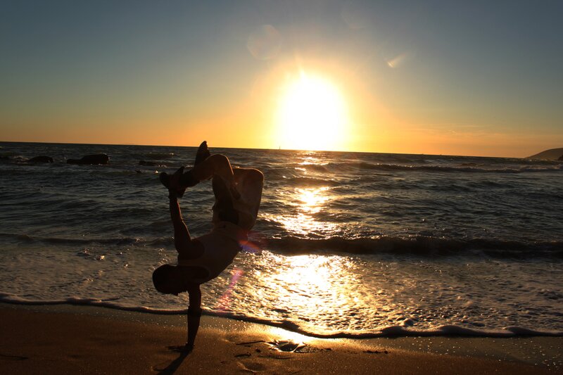 Person Doing Handstand — Gold, Dramatic