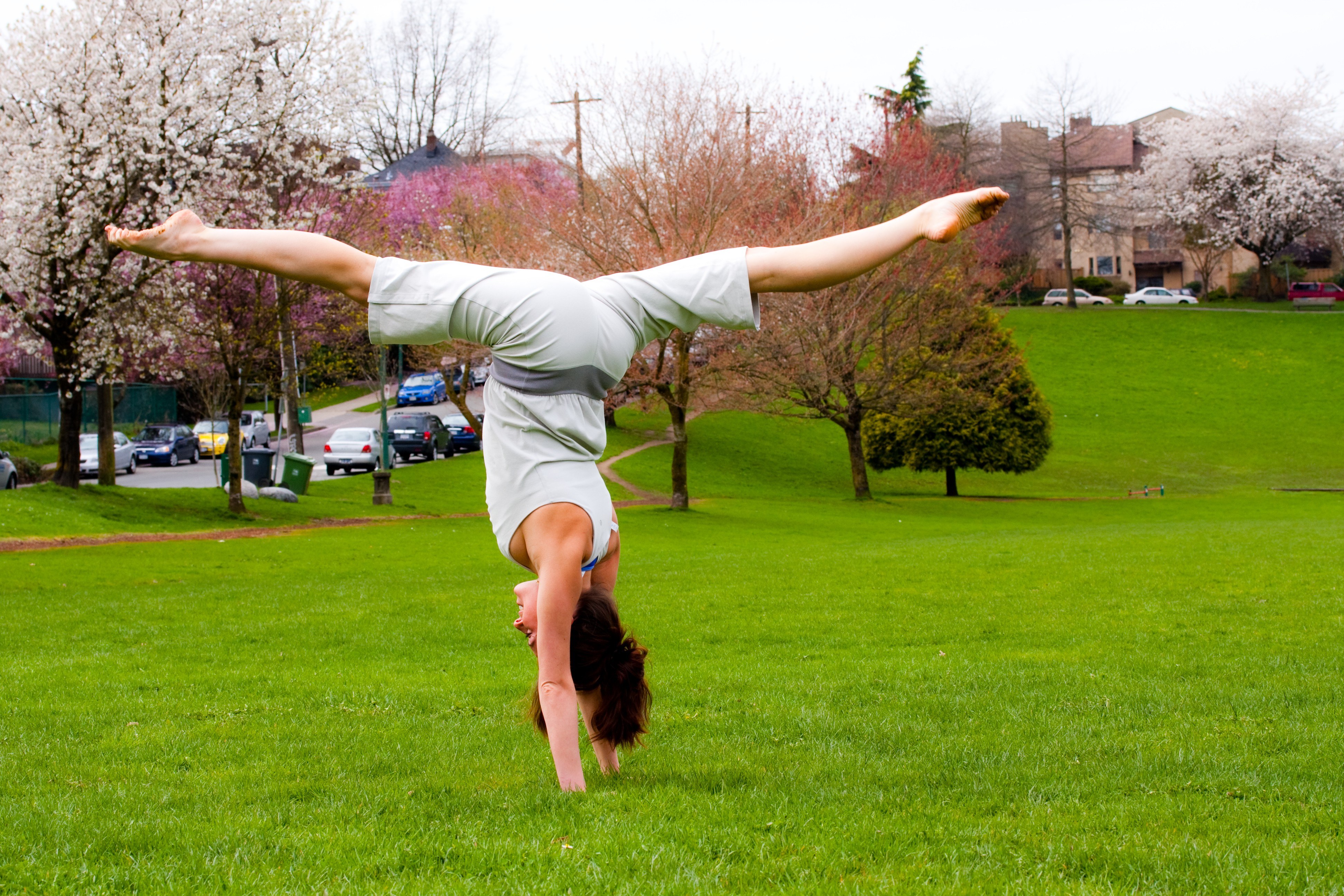Person doing handstand in park