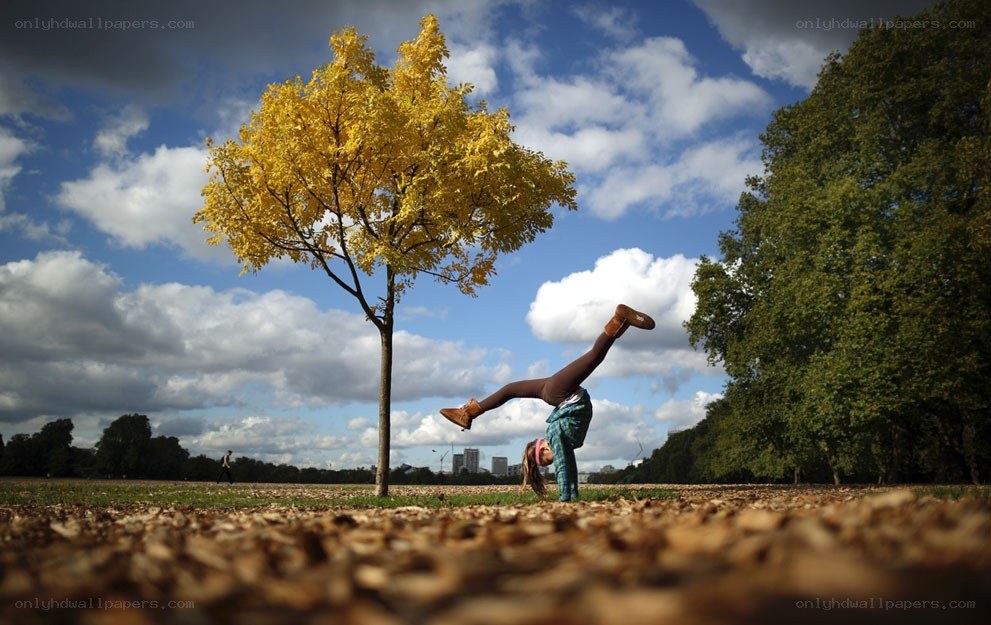Person doing handstand in park