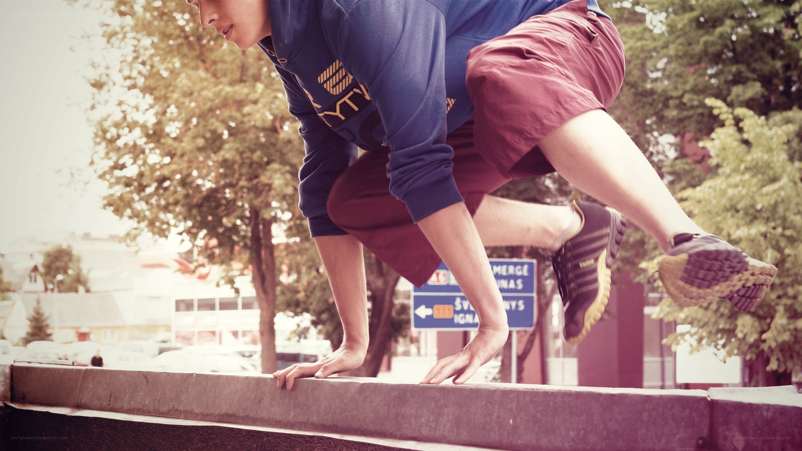 person doing parkour on ledge