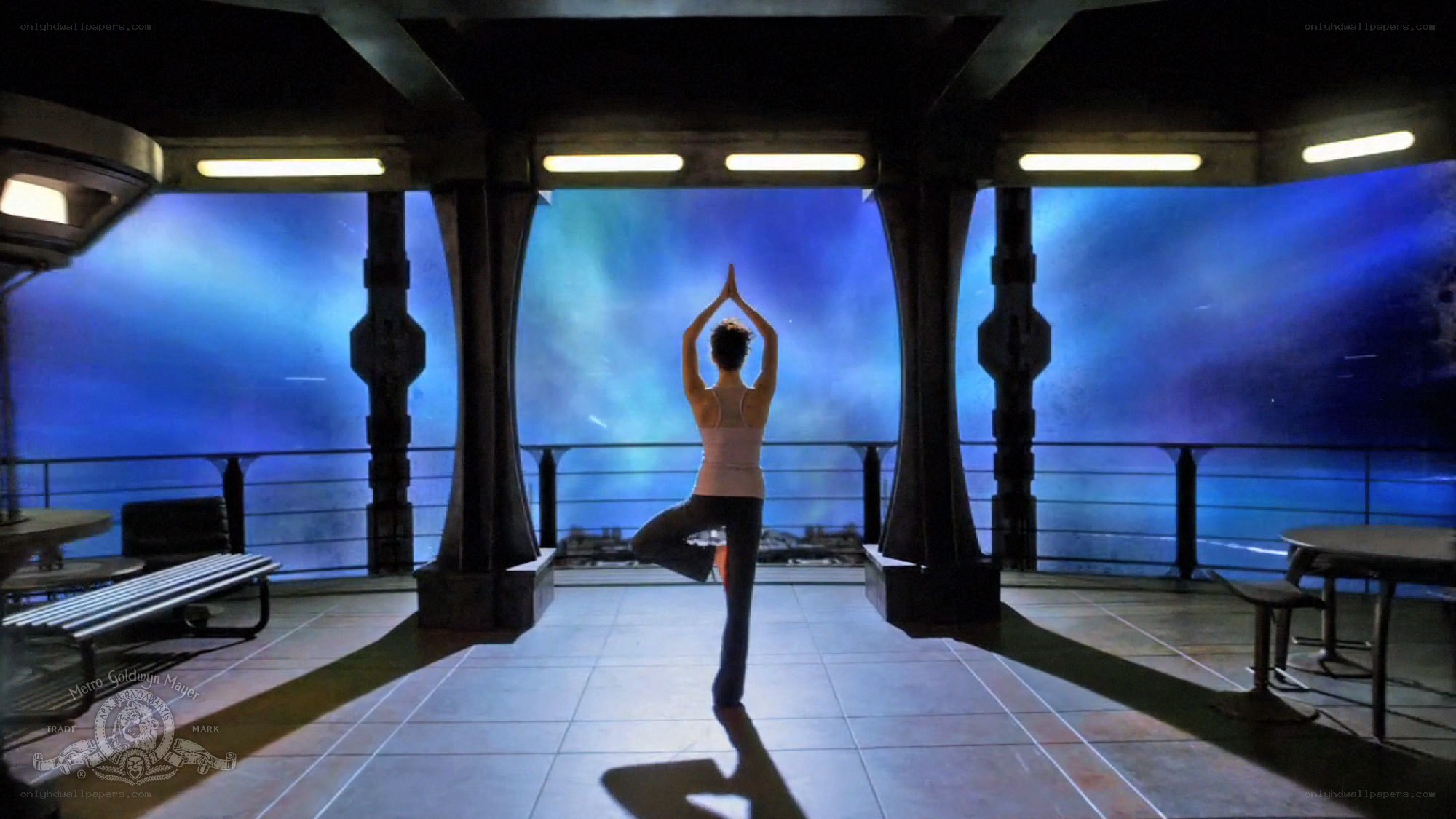 person doing yoga on spaceship