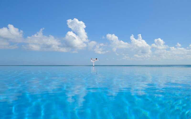 Person Doing Yoga on Water — Blue