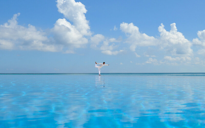 Person Doing Yoga on Water