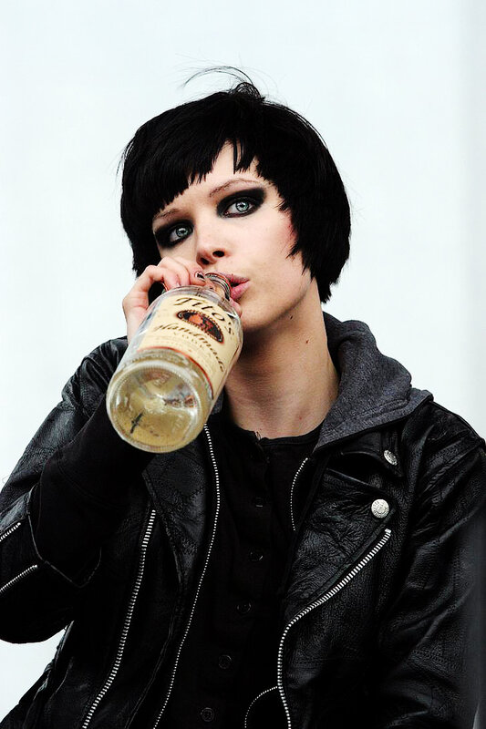 person drinking from bottle
