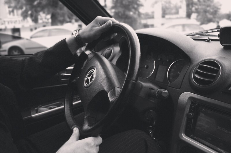 Person Driving Car — Black