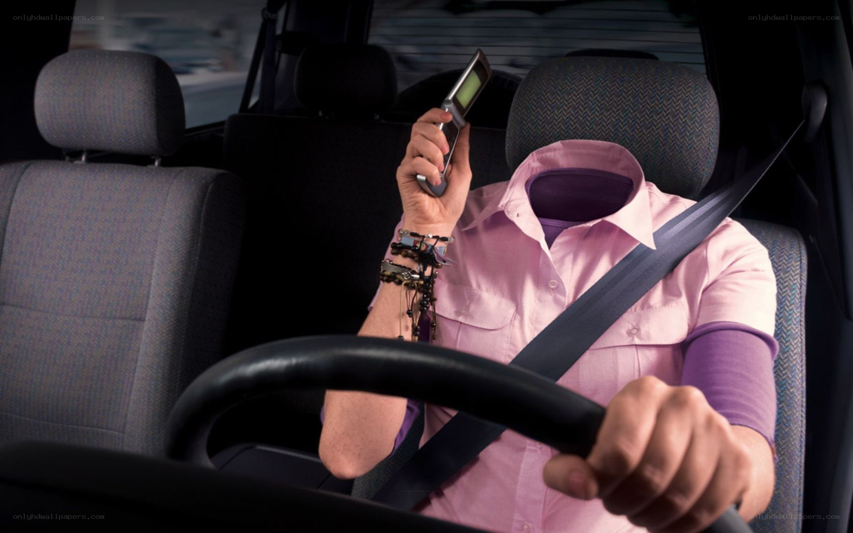 person driving with phone