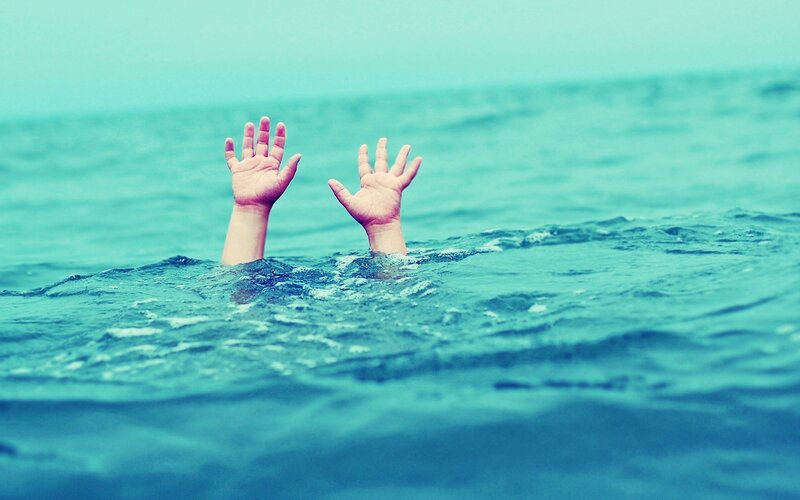 Person drowning in water