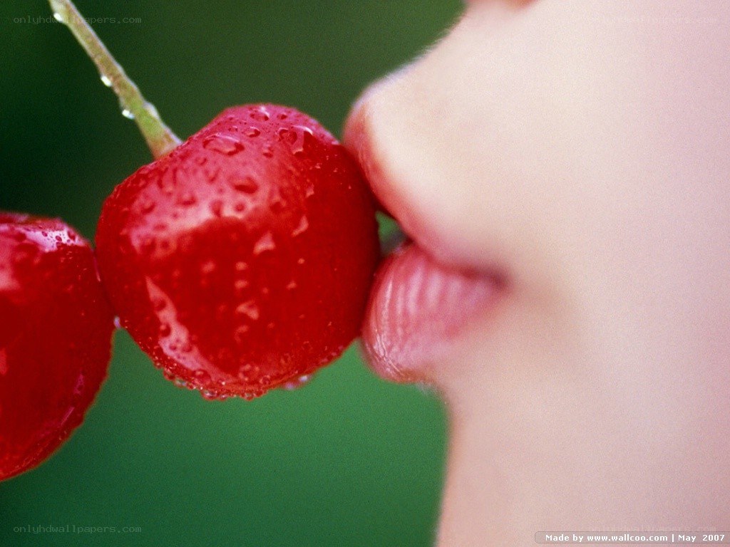 person eating a cherry