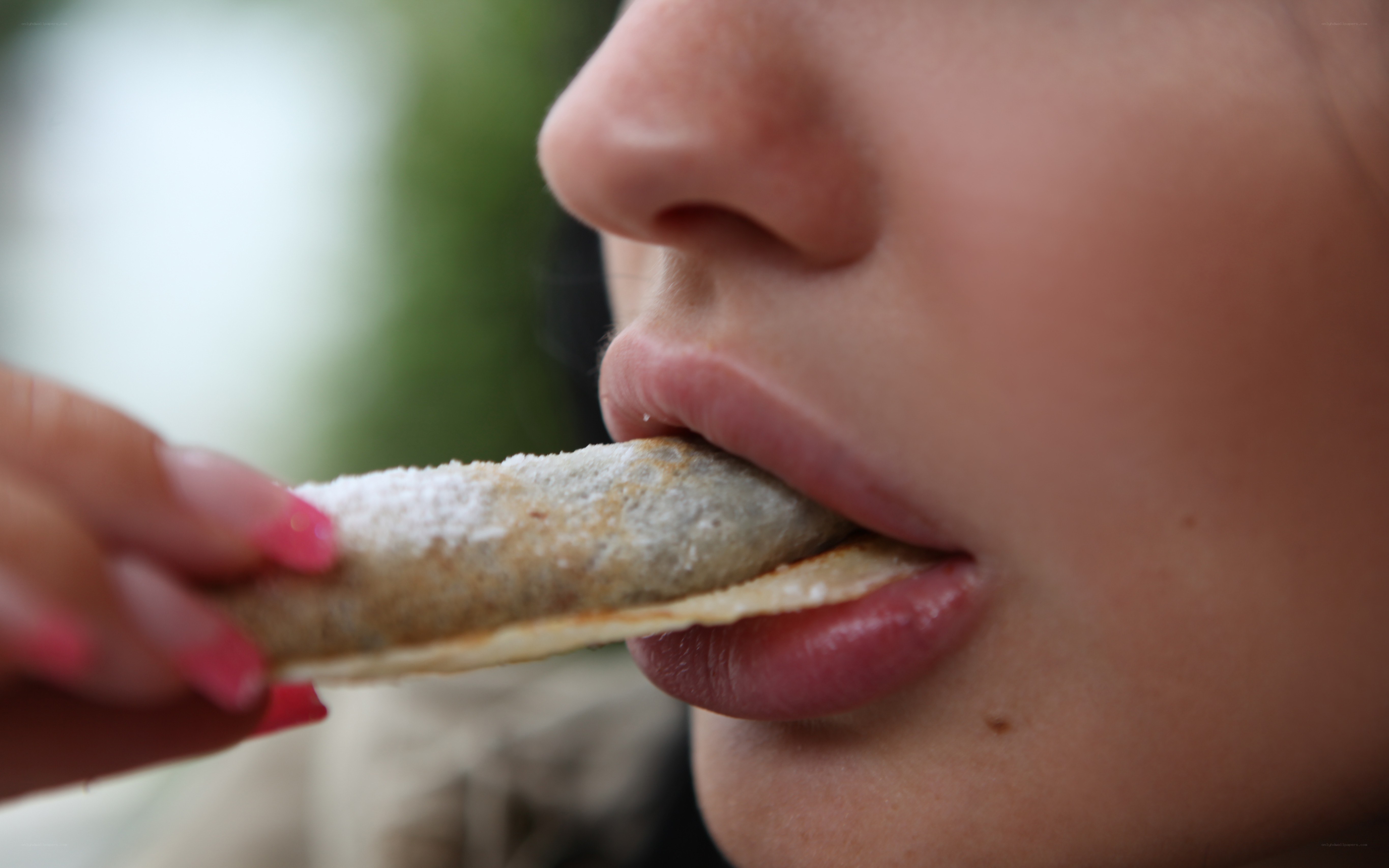 person eating a pastry