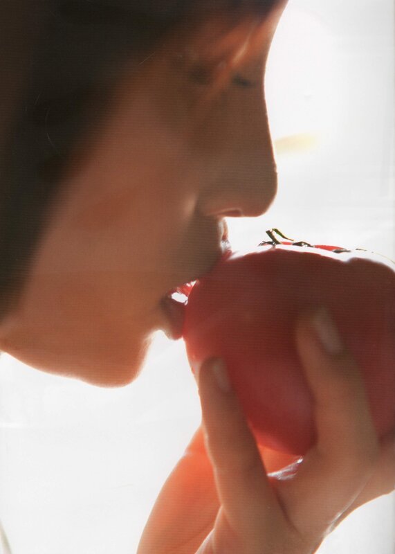 person eating a tomato