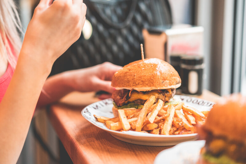 Person Eating Burger