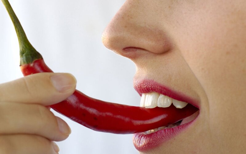 Person Eating Chili Pepper