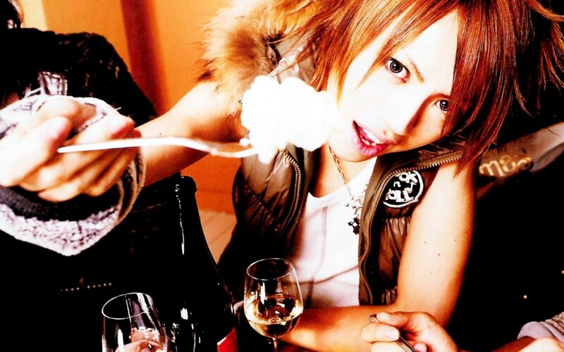 person eating dessert with wine