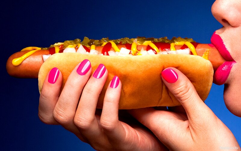 Person Eating Hot Dog