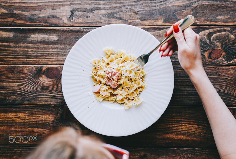 Person Eating Pasta