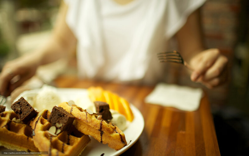 person eating waffles with ice cream