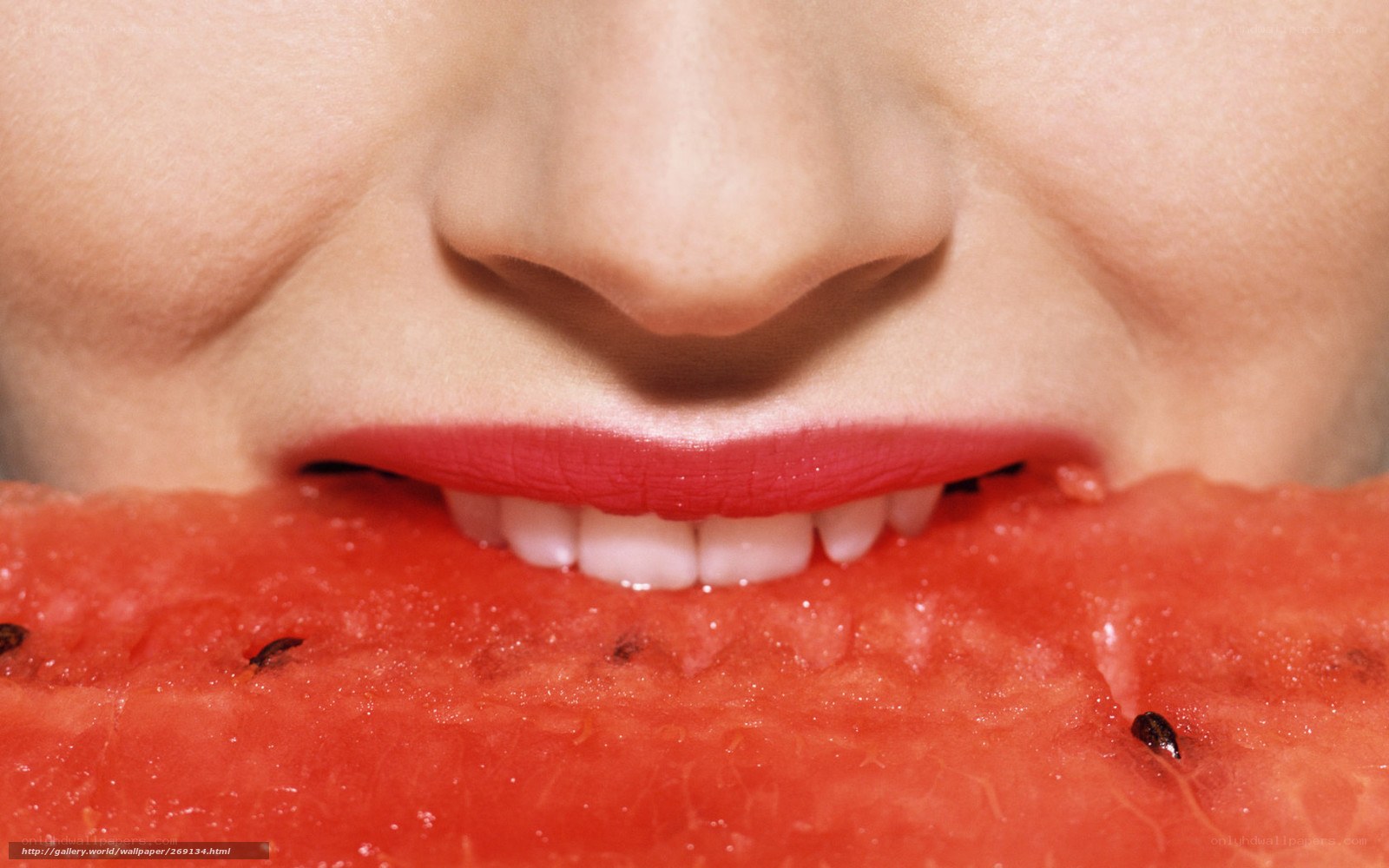 person eating watermelon slice