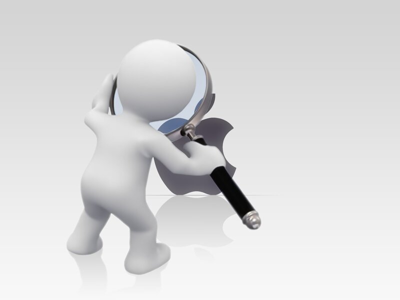 person examining apple logo