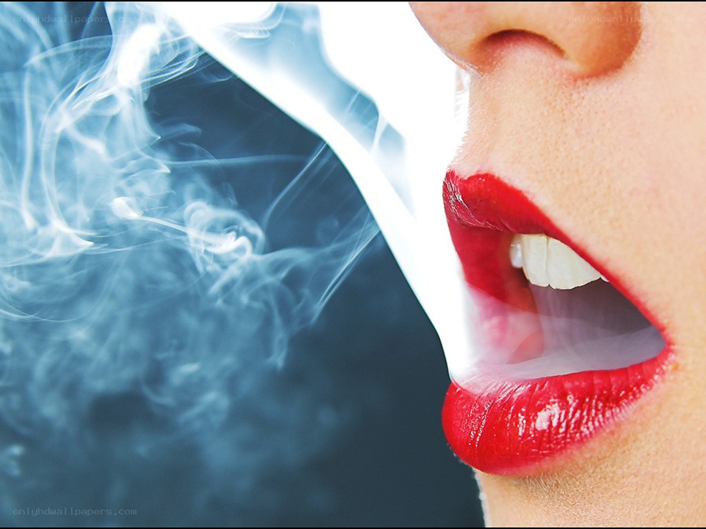 person exhaling smoke