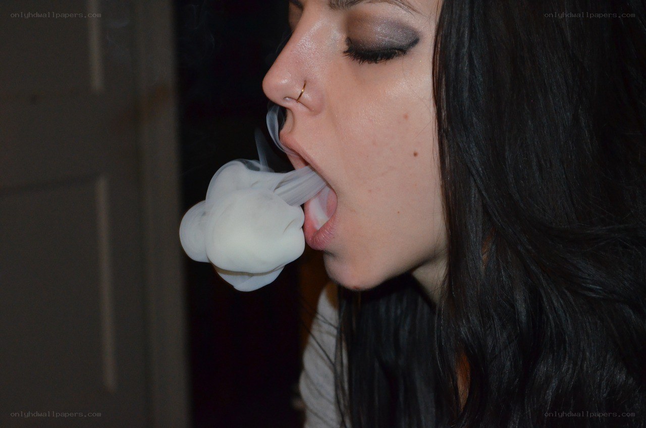 person exhaling vapor