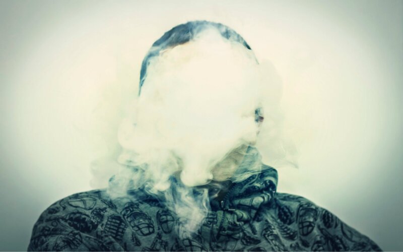 Person Exhaling Vapor — White
