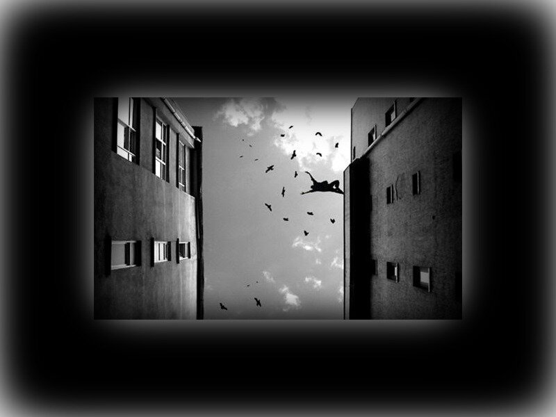 Person Falling Between Buildings — Black
