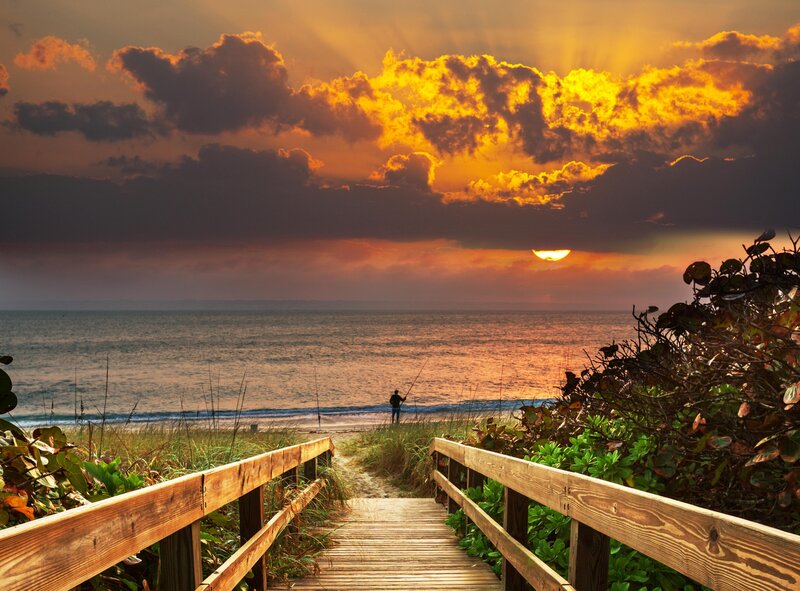 Person Fishing at Sunset — Orange, Dramatic