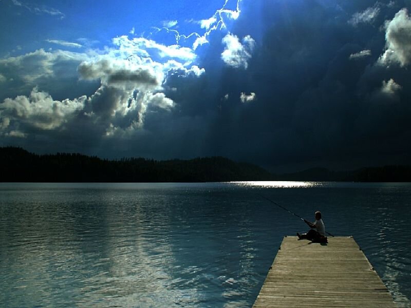 Person Fishing on Dock