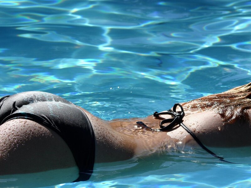person floating in a pool