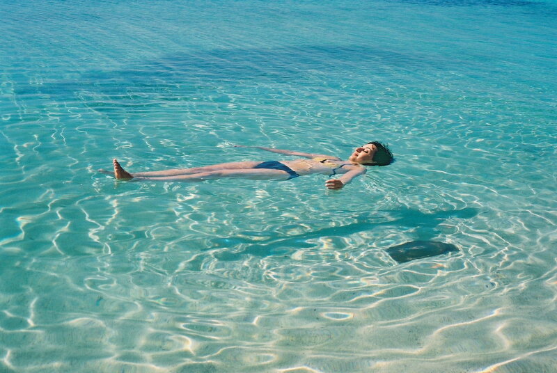 Person Floating in Water — Blue