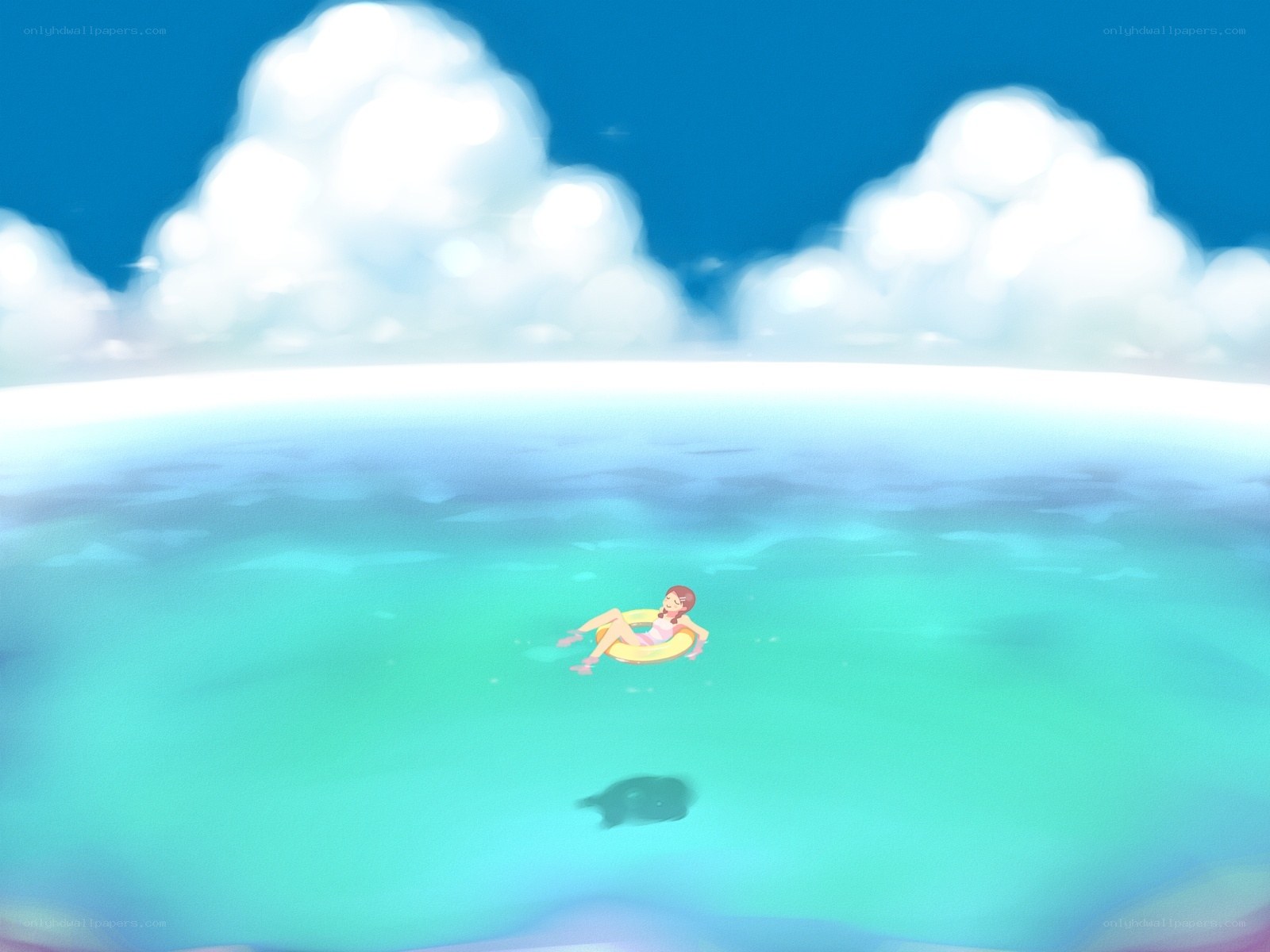 person floating on inflatable ring