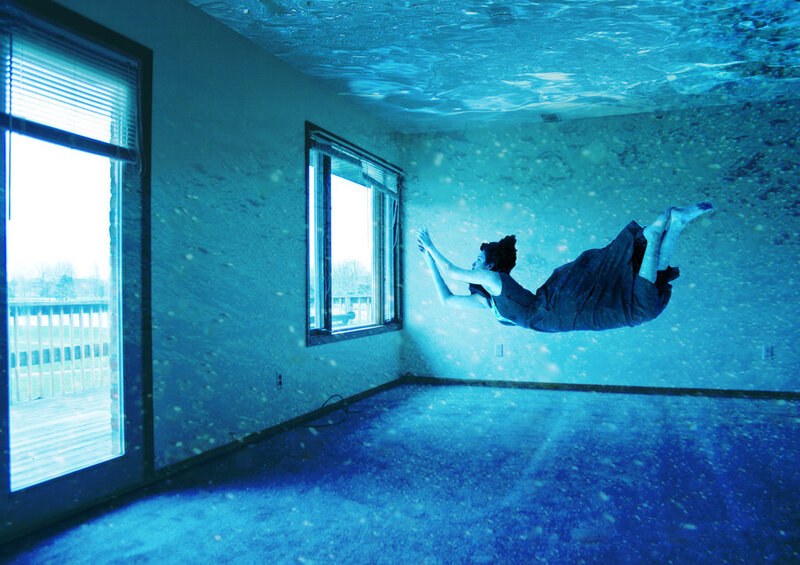 Person Floating Underwater — Blue