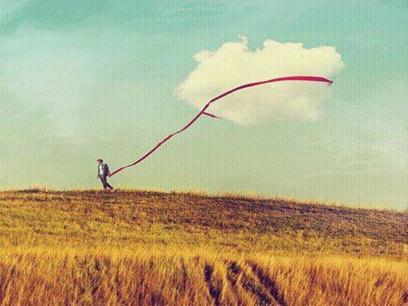 Person Flying Kite — Yellow