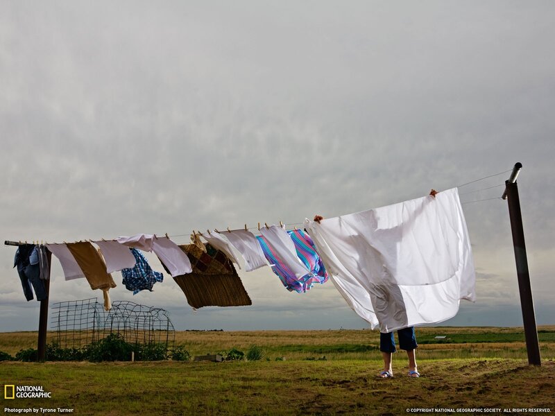 Person hanging laundry on a clothesline