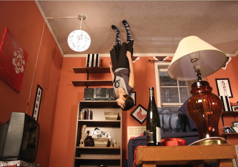 Person hanging upside down in room