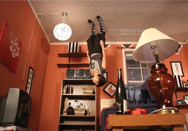 Person hanging upside down in room