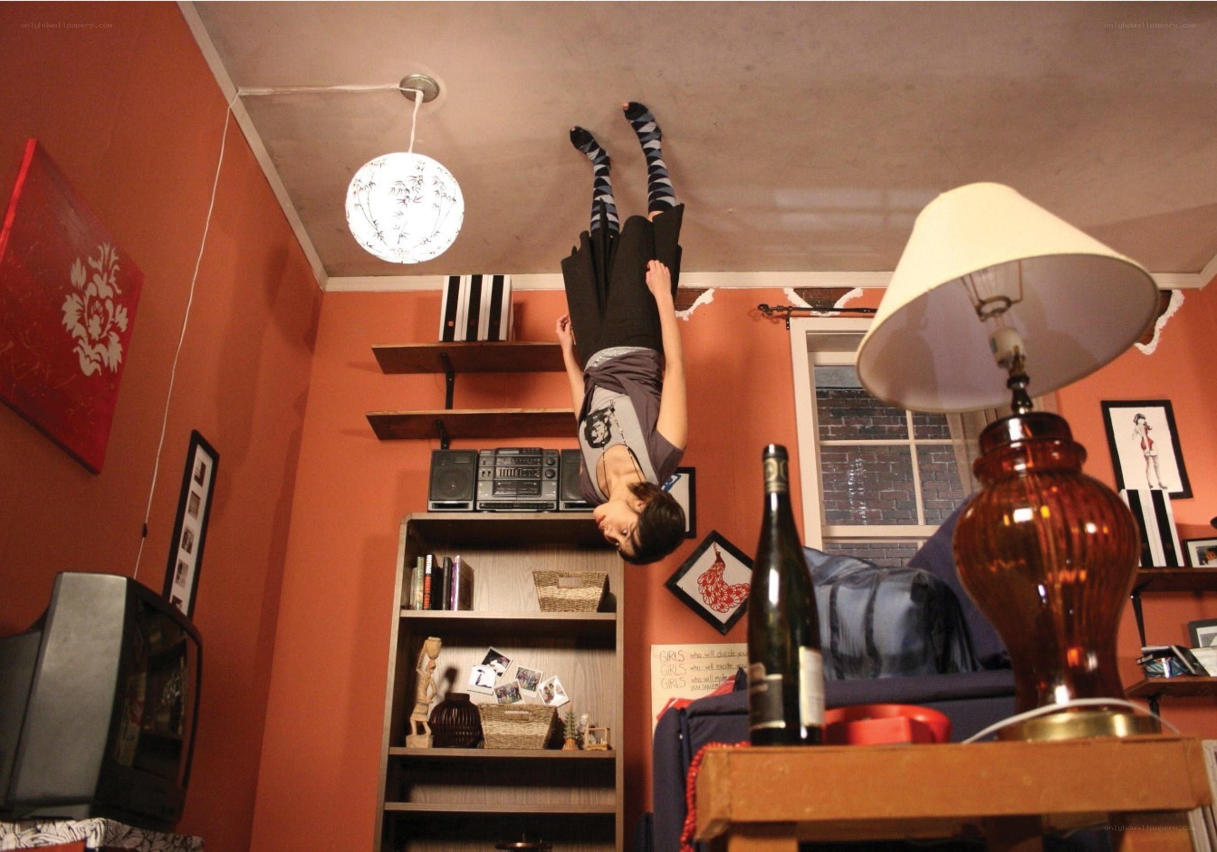 Person hanging upside down in room