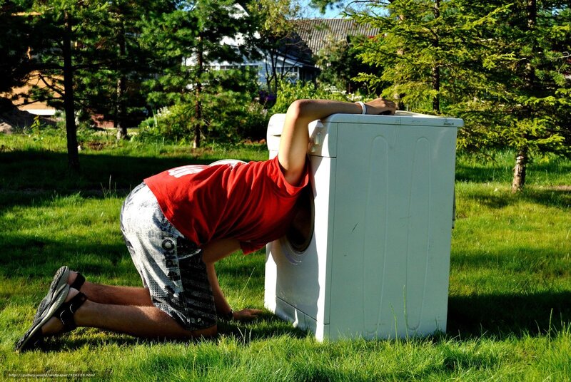 person hiding in washing machine