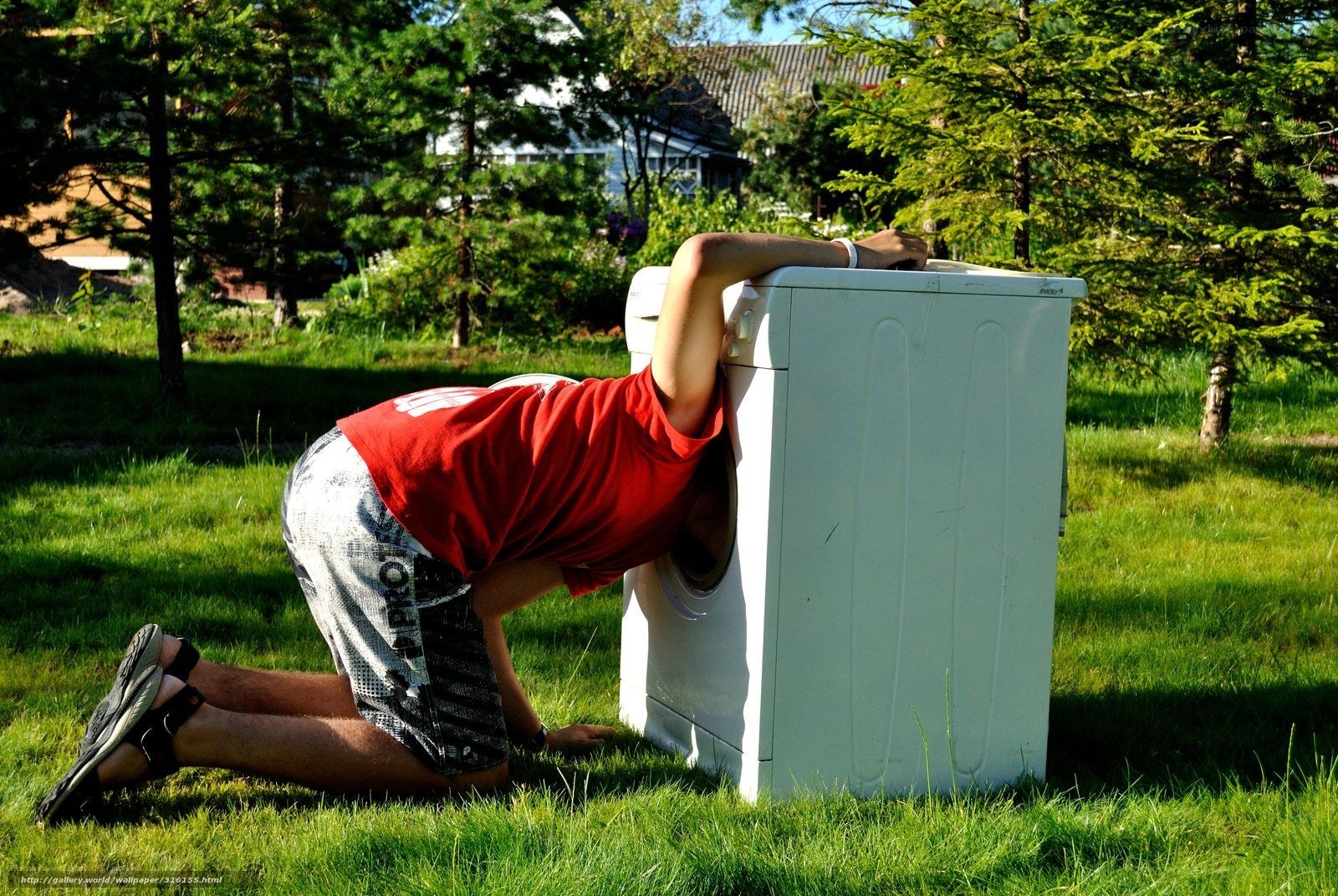person hiding in washing machine