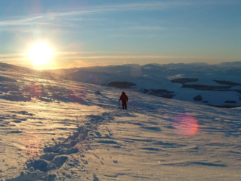 Person Hiking in Snow — Blue