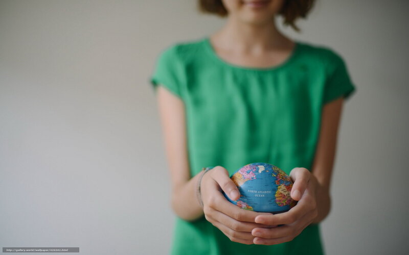 person holding a globe
