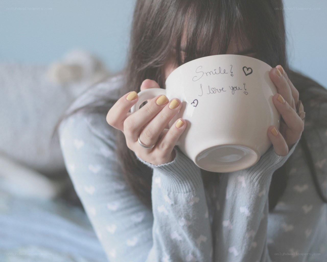 person holding a mug