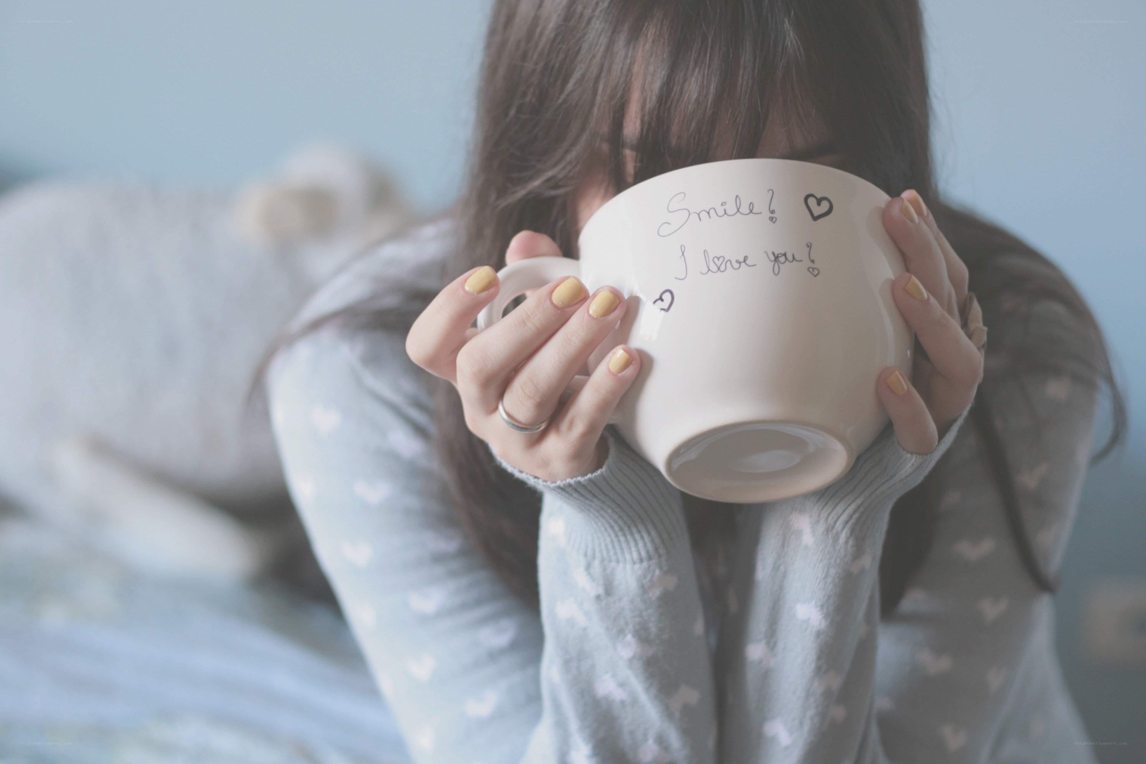 person holding a mug