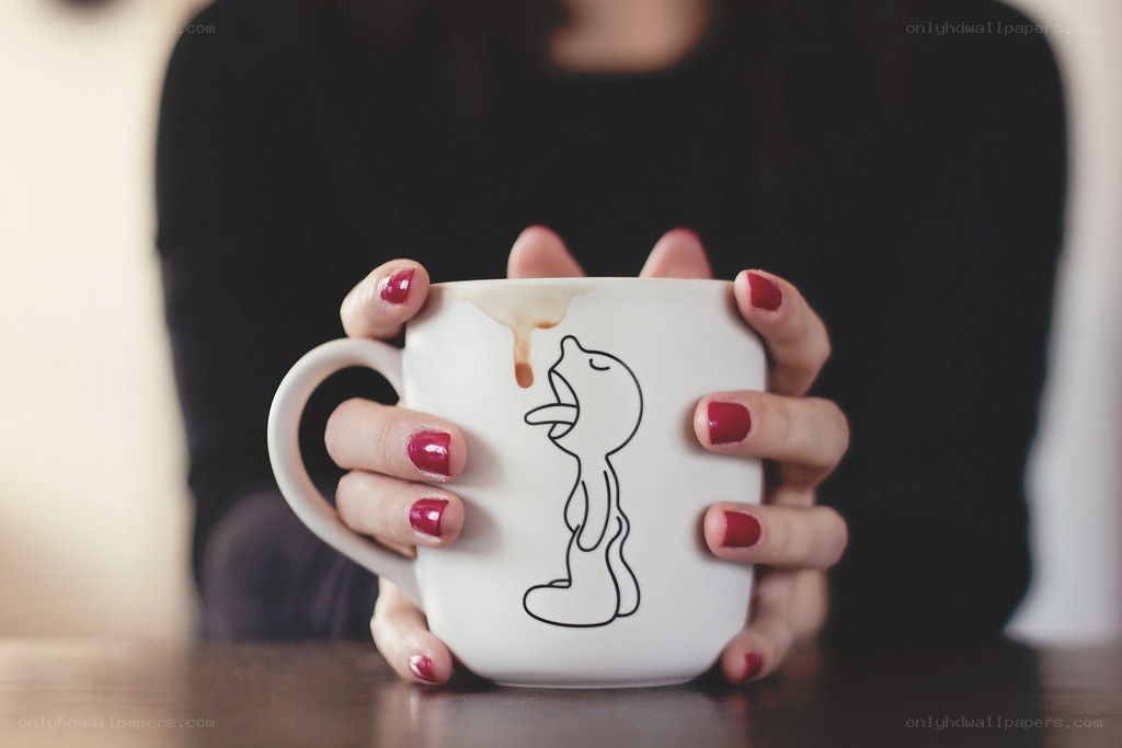 person holding a mug